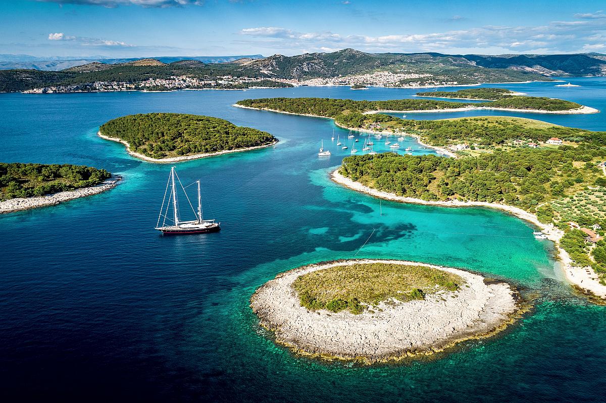 Gulet under sail between the pine-covered Pakleni islands off Hvar on Croatia’s Adriatic coast